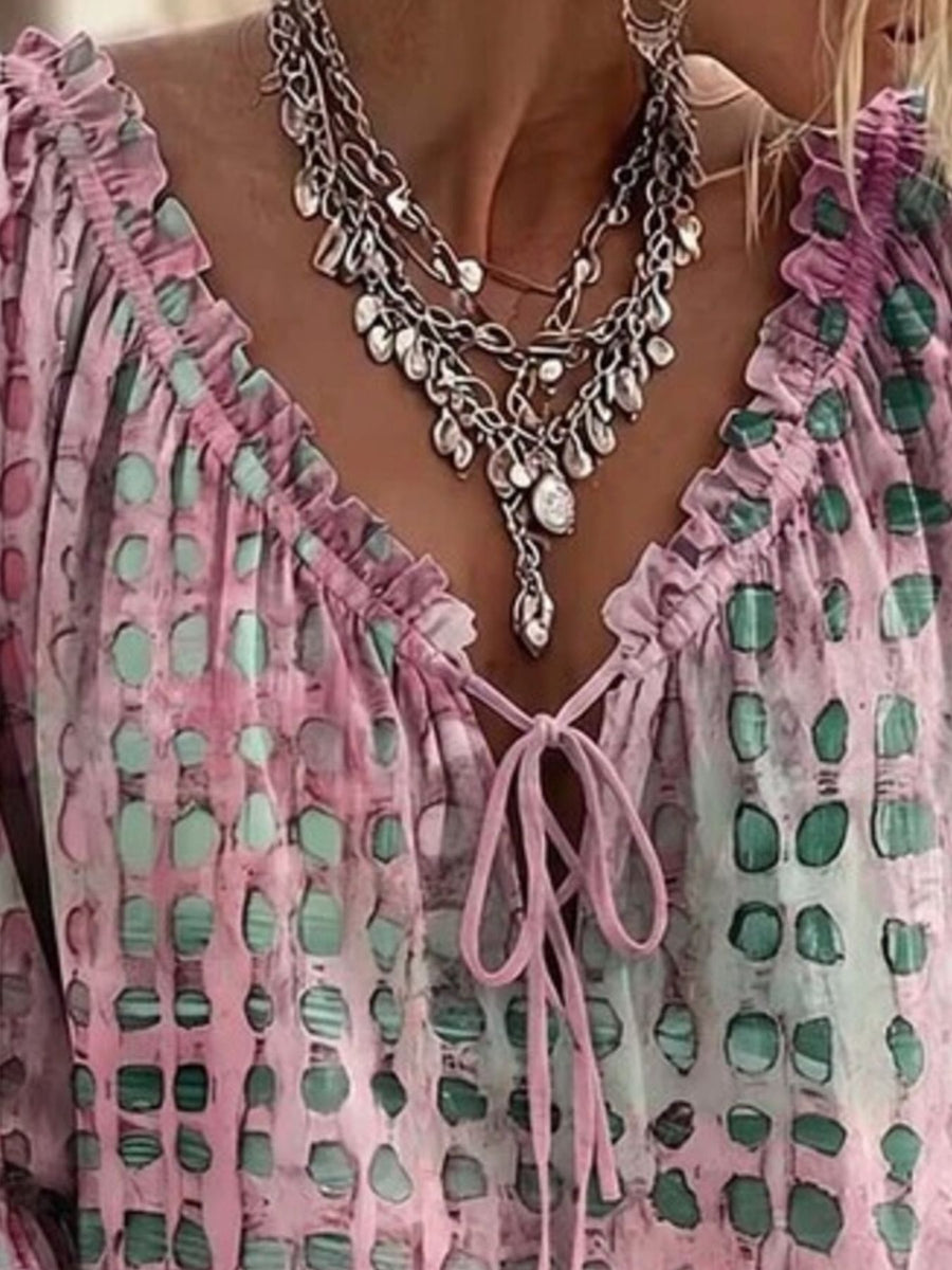 mint green blouse featuring tied and abstract-print