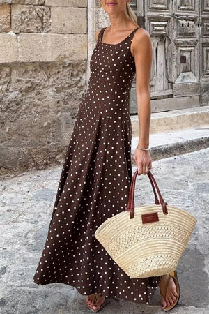 Brown polka dot sleeveless midi dress with square neckline.