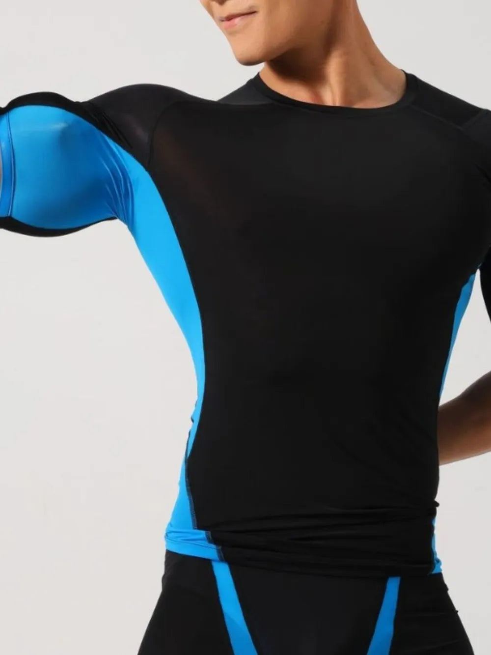 Men's black long sleeve t-shirt with blue performance panels and crew neck.