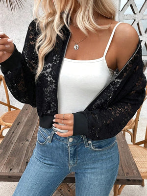 Black bomber jacket featuring zipper and floral