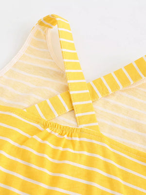 Yellow striped cotton blend toddler dress with criss-cross straps.