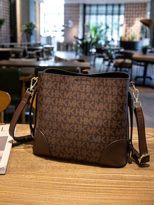 crossbody bag featuring monogram in Caramel with PU Leather Imported Size &amp texture