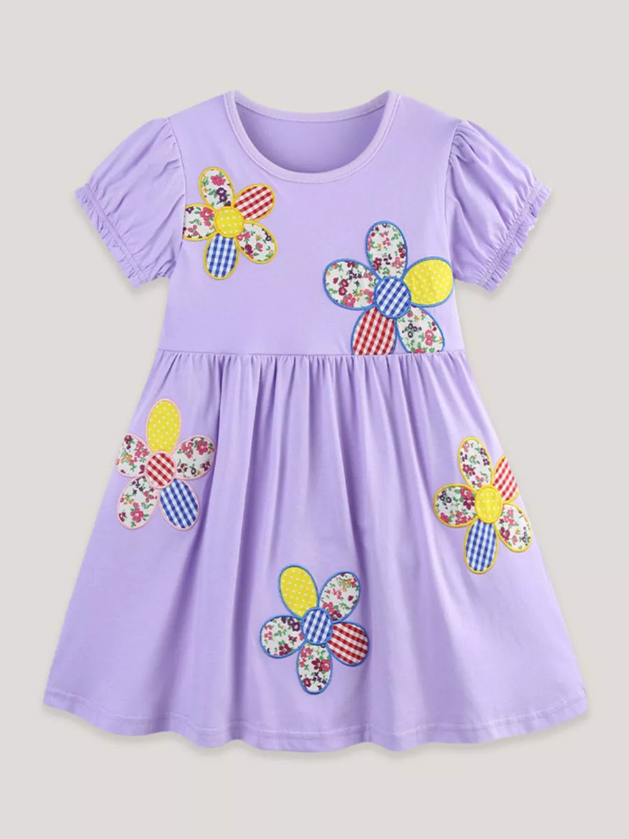 Lavender cotton toddler dress with colorful floral appliqués and puff sleeves.