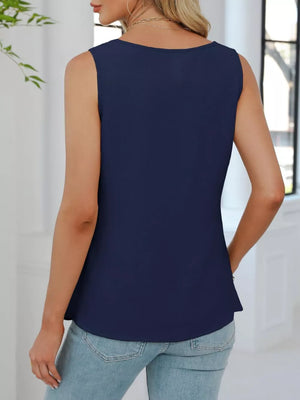 Navy blue V-neck pleated tank top with a textured fabric and a relaxed fit.