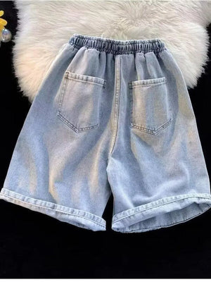 Men's light wash relaxed fit denim shorts with elastic waistband and back pockets.
