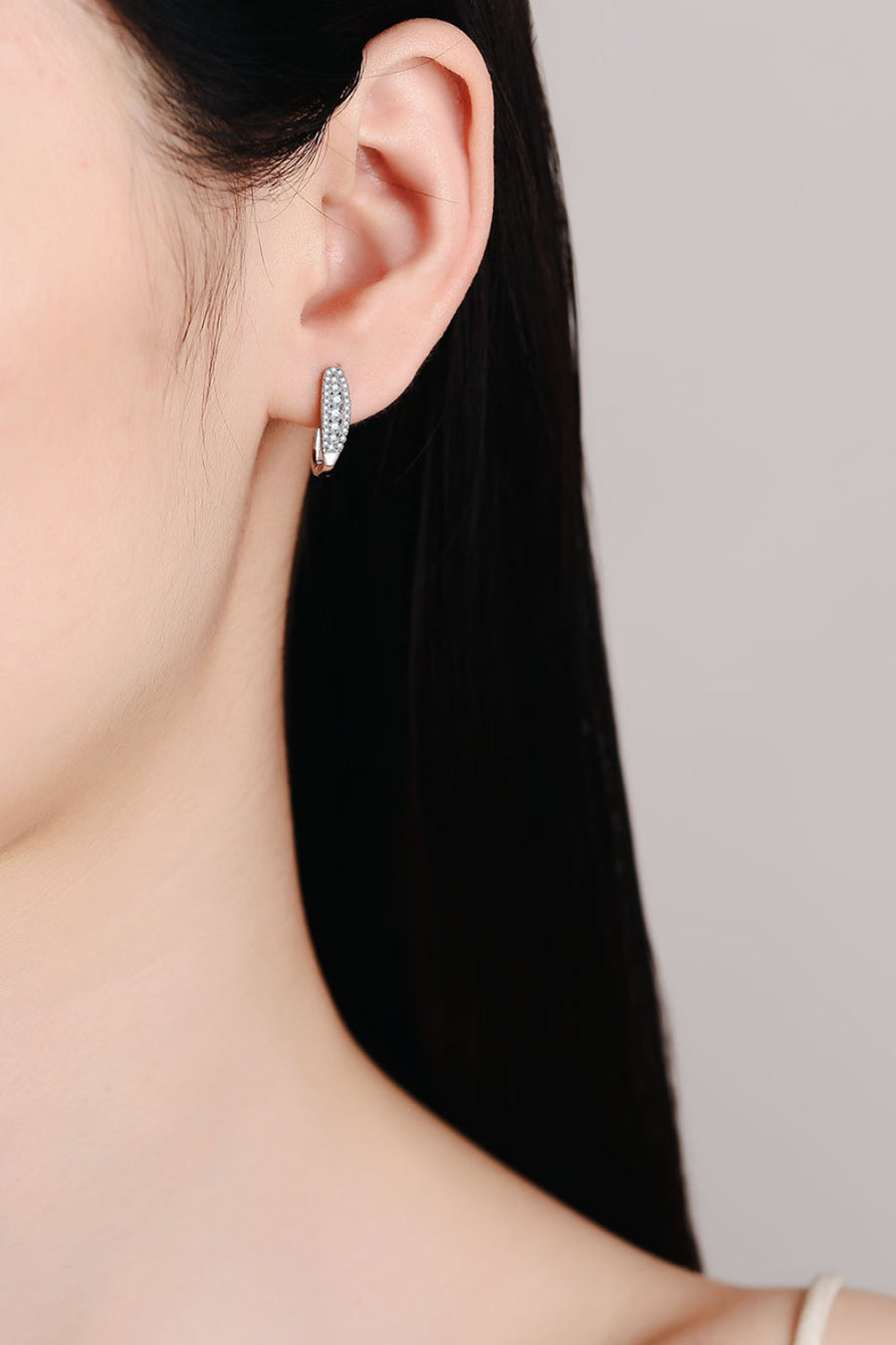 Silver pavé hoop earrings with sparkling stones, a modern essential for women.