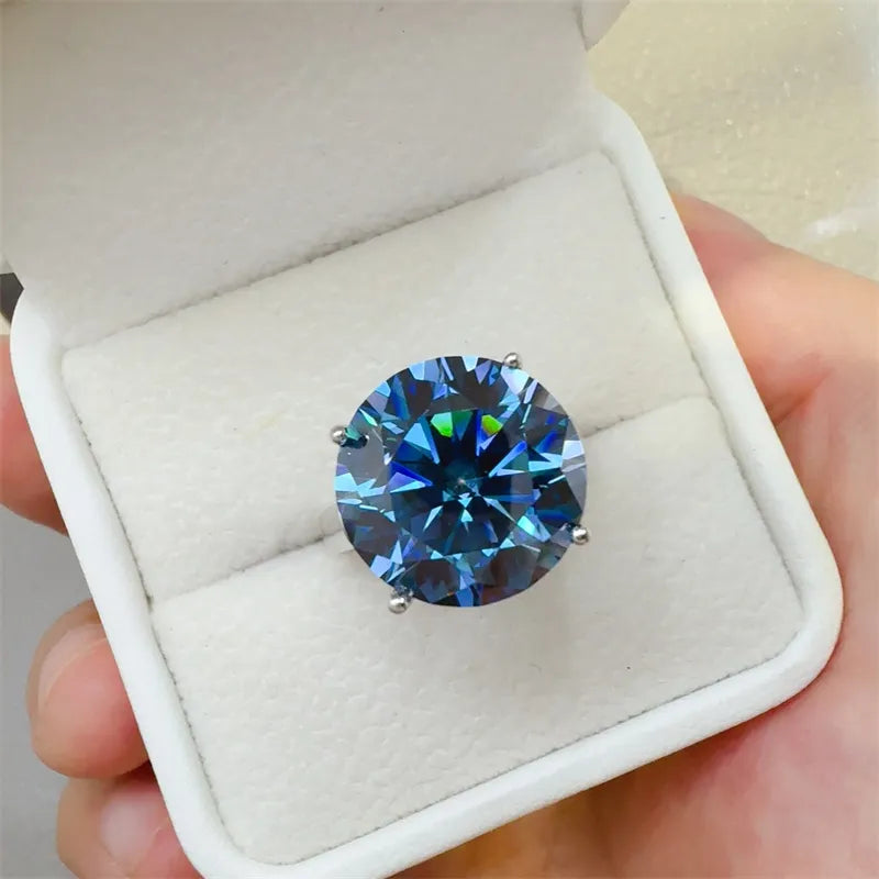 Celestial Azure Moissanite Statement Ring in silver with a brilliant cut blue stone.