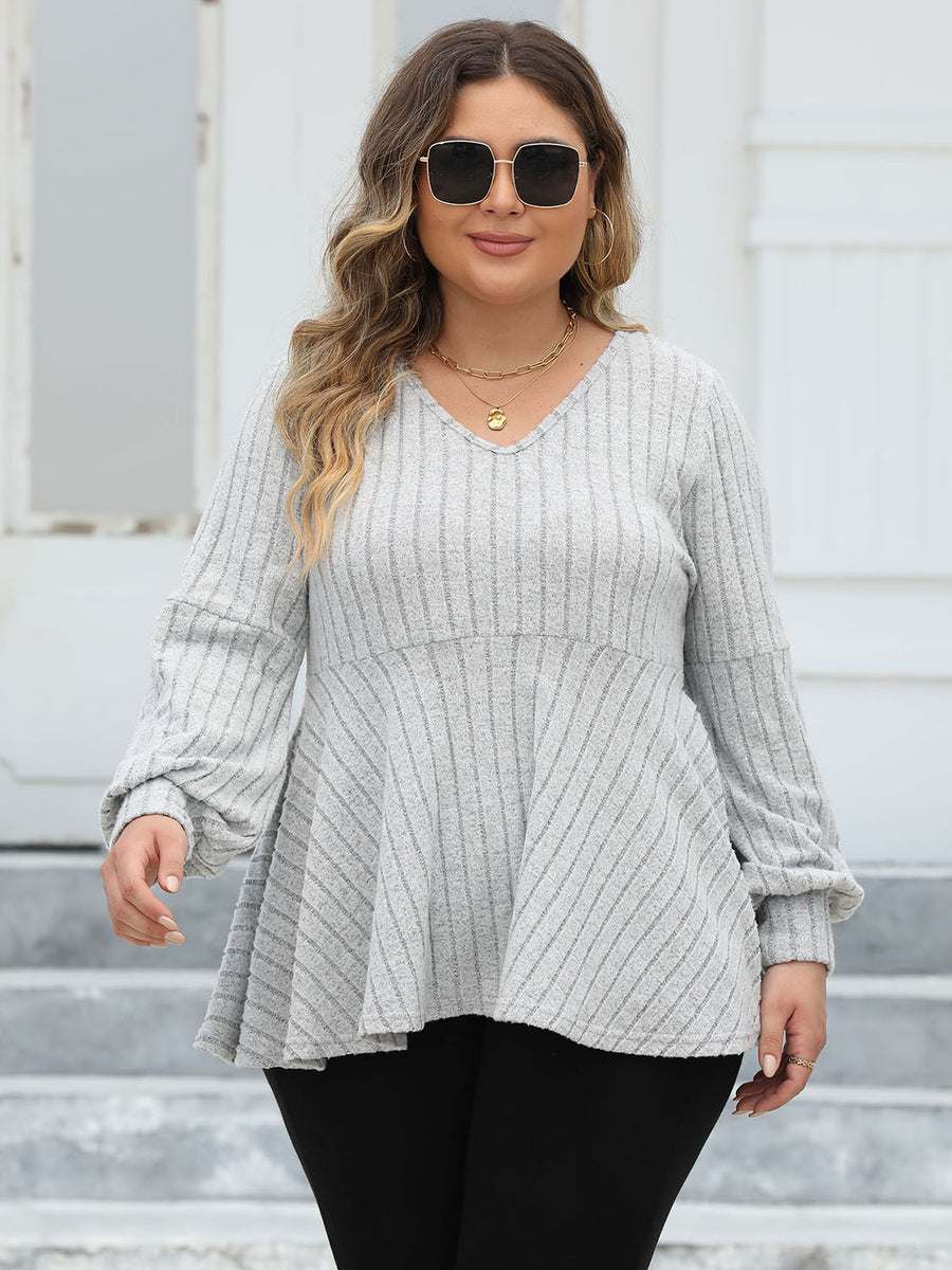 Light gray ribbed peplum blouse with blouson sleeves and v-neck