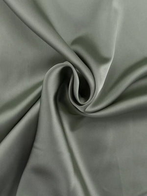 Sage green satin fabric with a smooth, lustrous finish and soft drape.