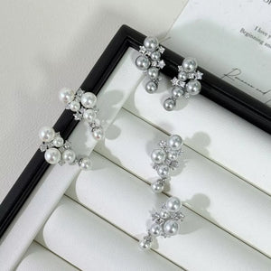 Sophisticated pearl and zircon cluster earrings in light gray and white.