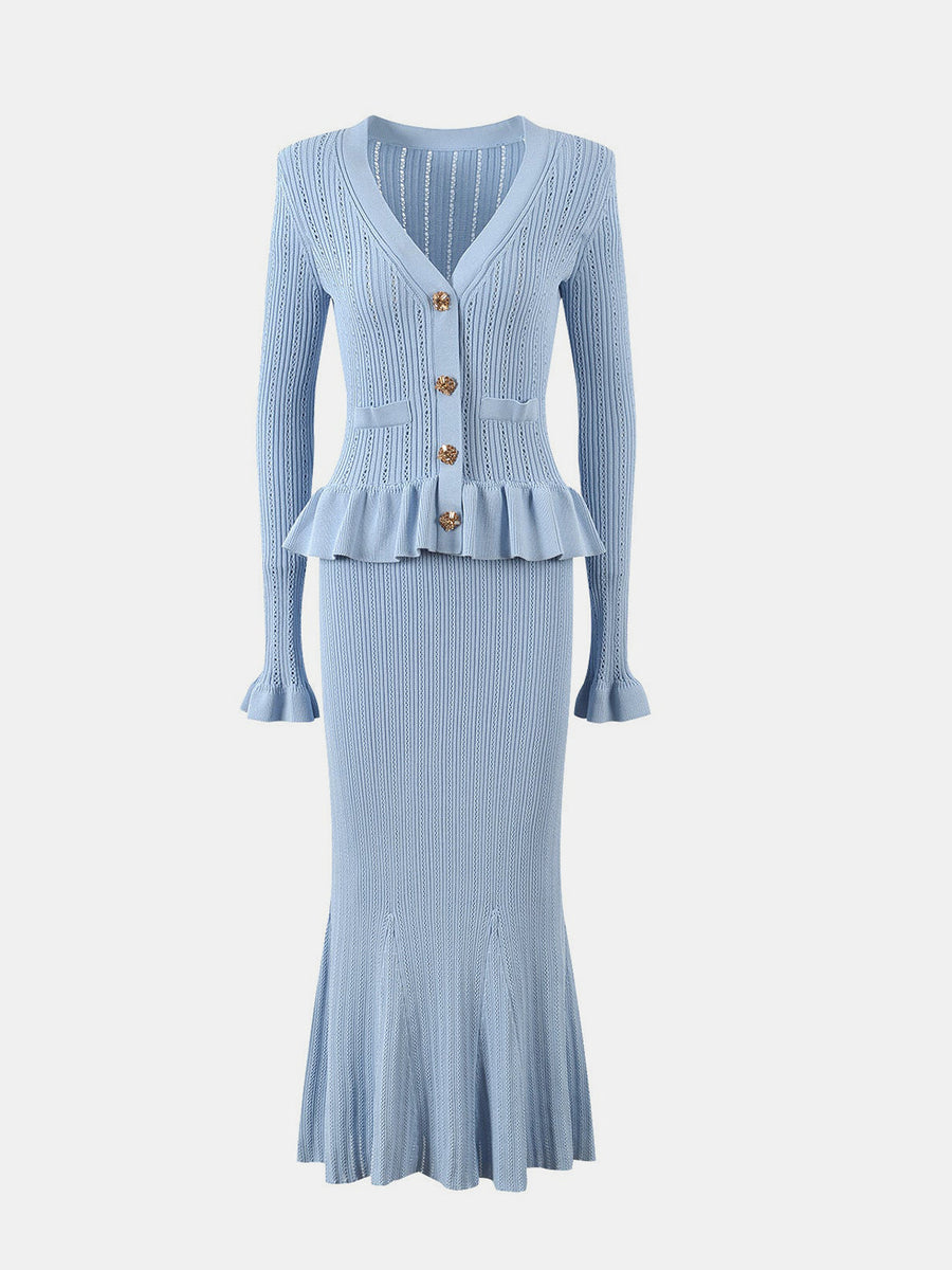 Light blue knit cardigan with ruffled peplum and skirt set, featuring gold buttons and flared cuffs.