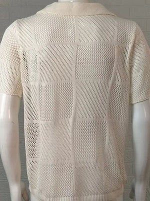 Ivory geometric knit polo shirt with a mesh pattern and short sleeves.