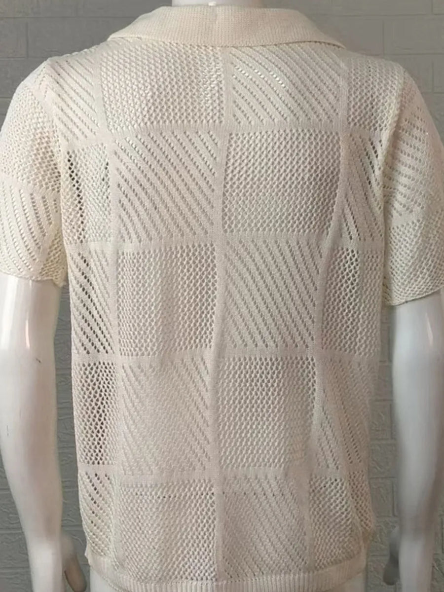 Ivory geometric knit polo shirt with a mesh pattern and short sleeves.
