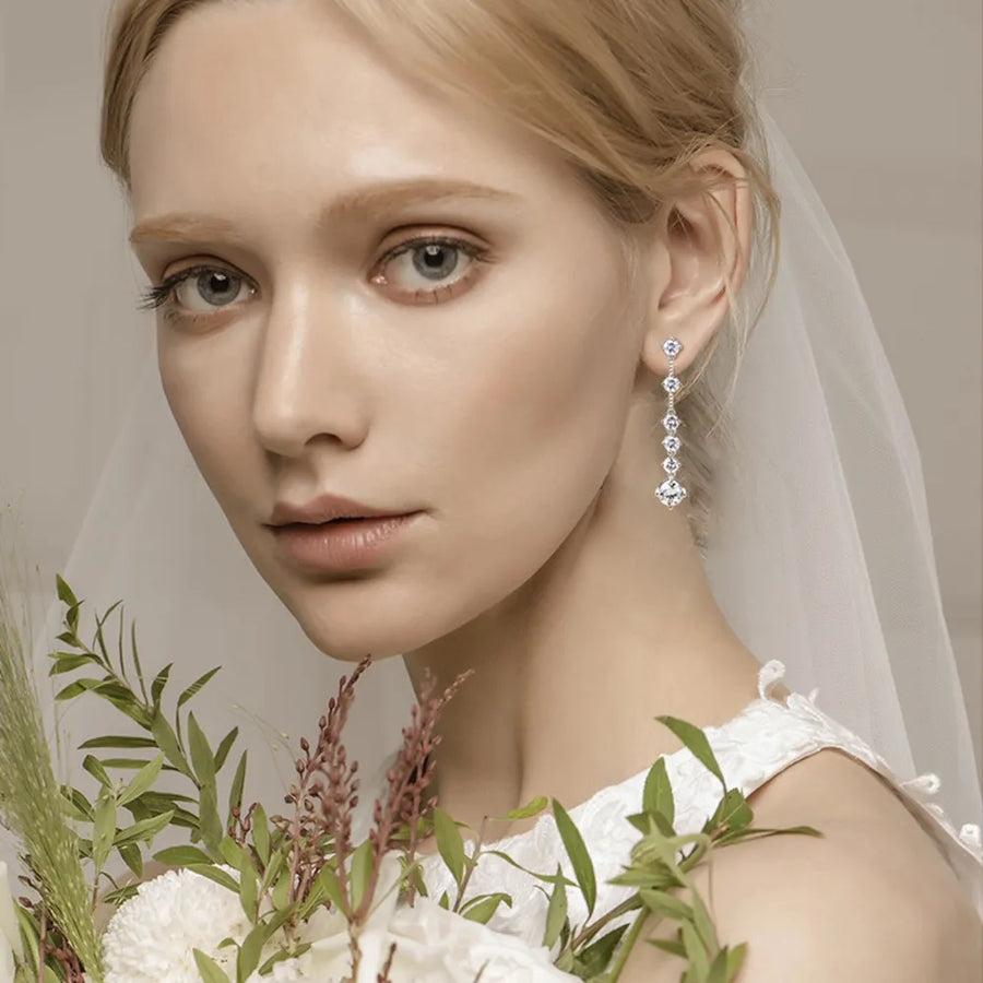 Silver cascading diamond drop earrings with a brilliant sparkle.