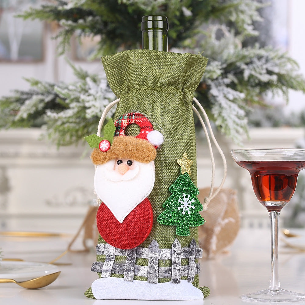 Festive Santa wine bottle gift bag with a Christmas tree accent.
