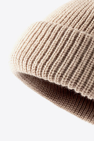 Beige ribbed knit beanie with folded edge detail