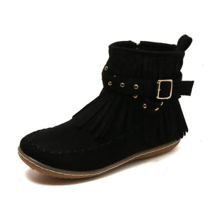 Black suede ankle boots with fringe, studs, and buckle strap detail.