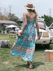 Turquoise floral tiered cami maxi dress with tassel detail and a bohemian print.