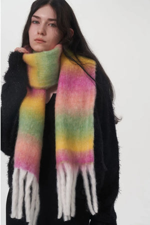 Gradient mohair scarf with fringe in pink, yellow, and green hues.