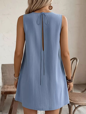 Light blue sleeveless dress with tie-back detail and open back.