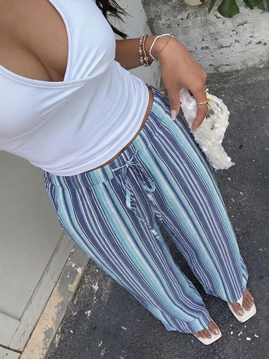 Lively striped drawstring wide-leg pants in blue and white with a relaxed fit.