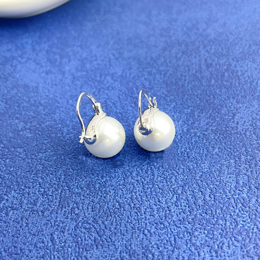 Silver plated pearl hoop earrings with lever back closure.
