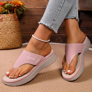 Pink toe post platform sandals with a comfortable cushioned sole and "Fashion" detail.