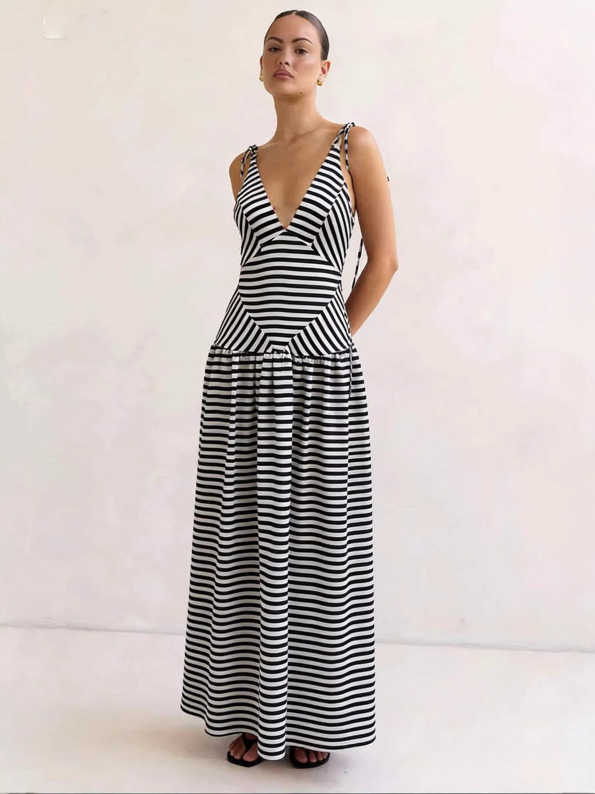 Chevron striped maxi dress with V-neck and tie straps in black and white.
