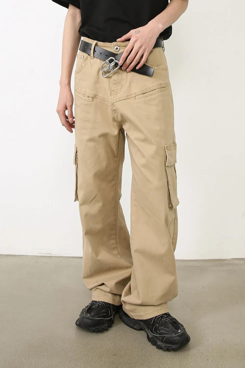 Khaki wide-leg cargo pants with multiple pockets and a relaxed fit.