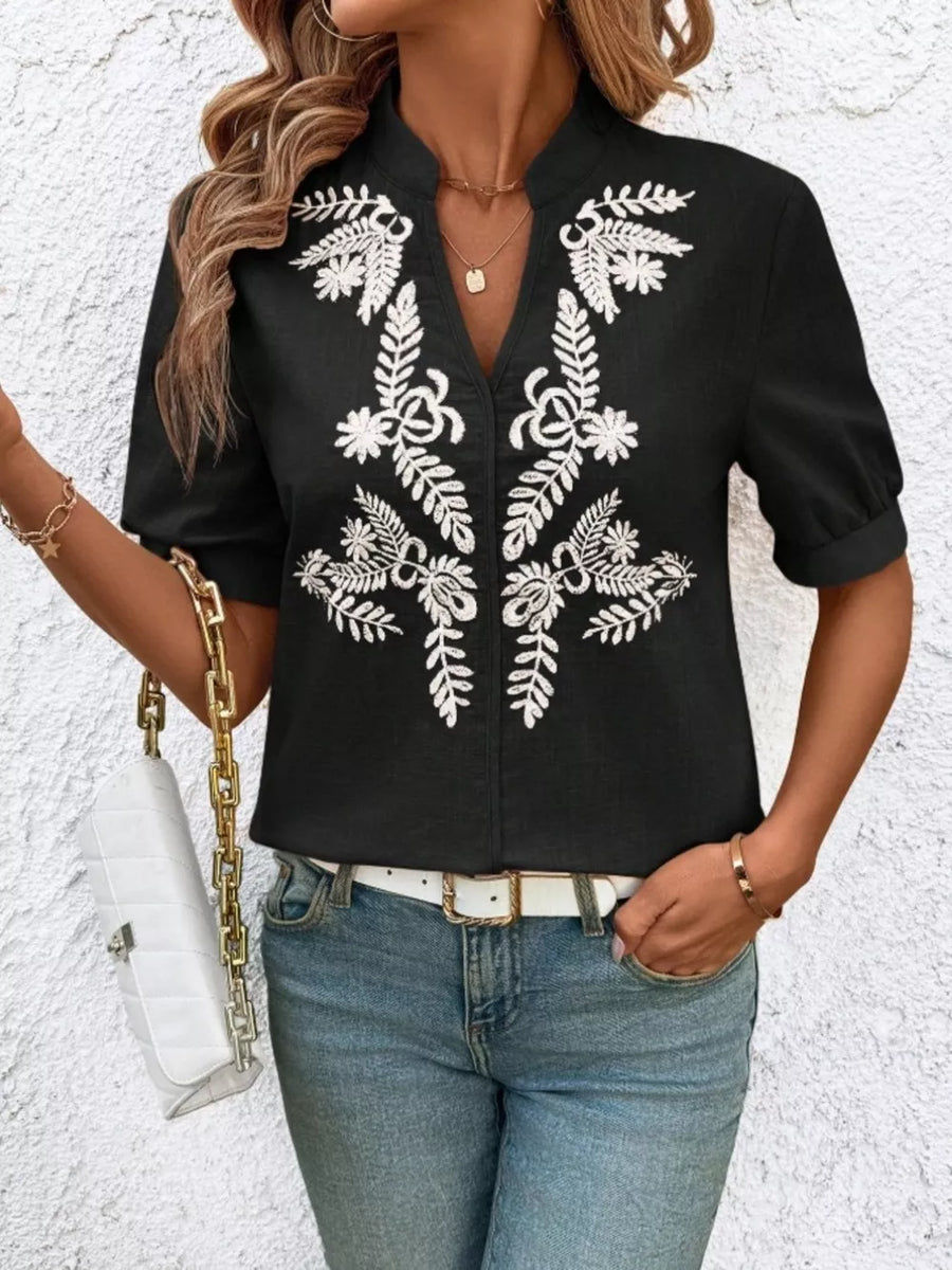 Black embroidered notched blouse with cuffed sleeves and V-neck.