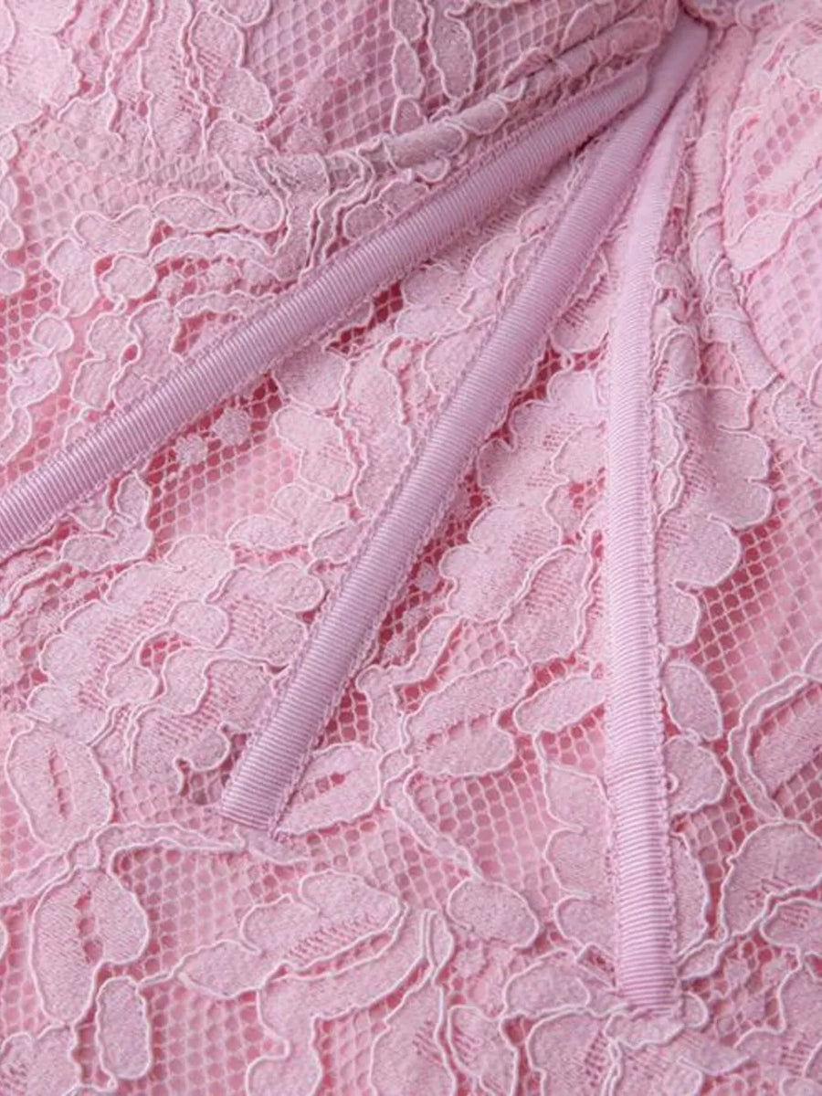Pink lace midi dress with sheer sleeves and ribbon detail