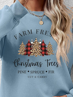 Misty Blue crewneck sweatshirt with Christmas trees graphic, plaid and leopard patterns, and text.