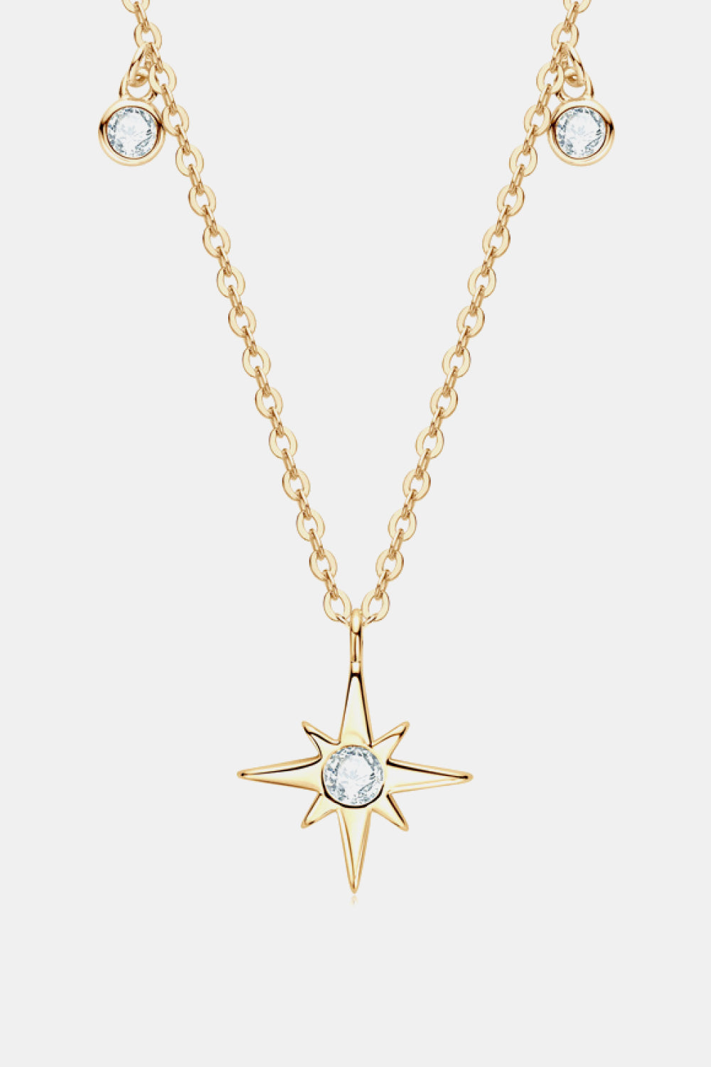 Gold celestial compass pendant necklace with moissanite and dainty chain.