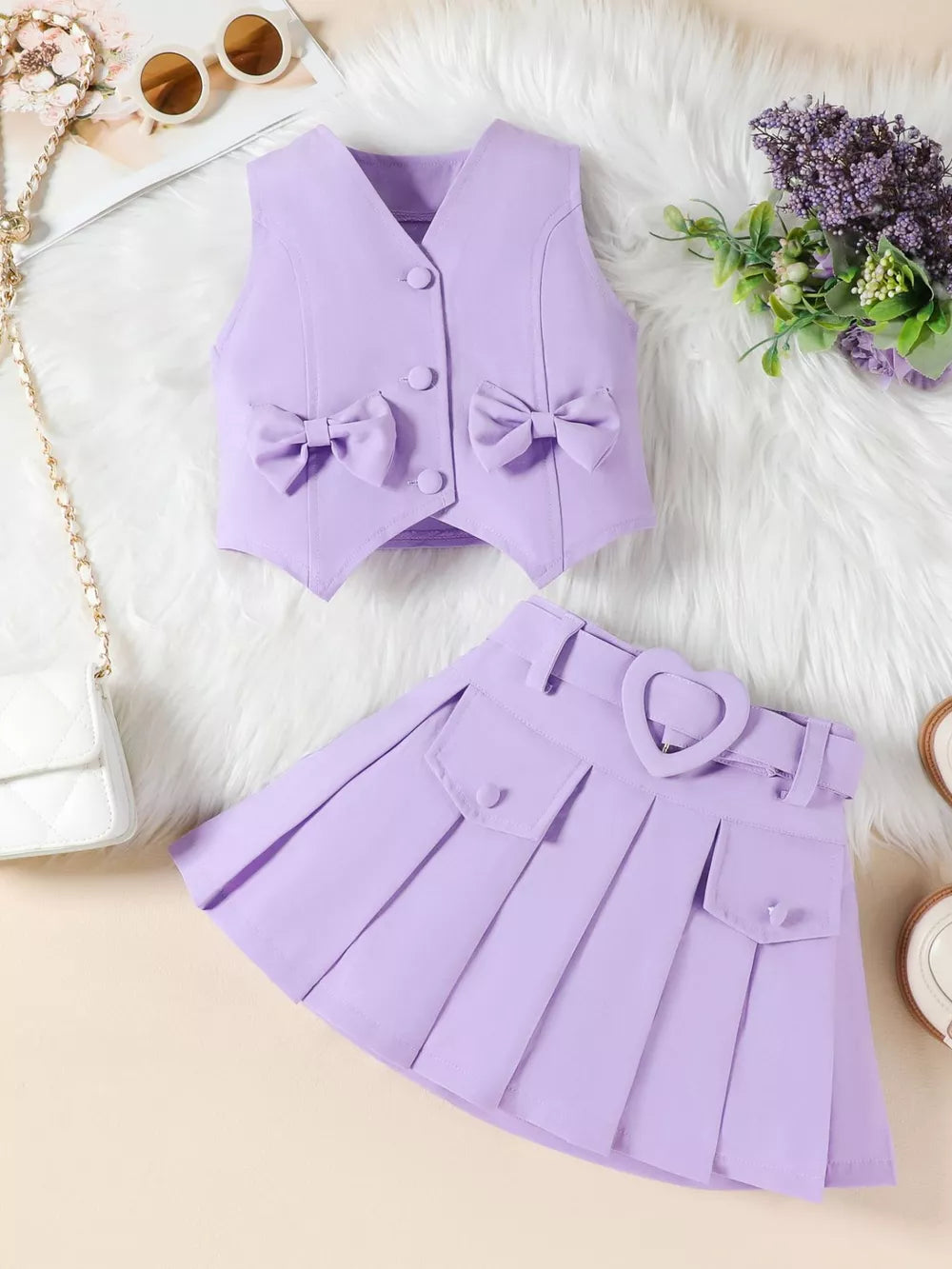 Purple baby vest with bowknot details and pleated skirt with heart buckle belt