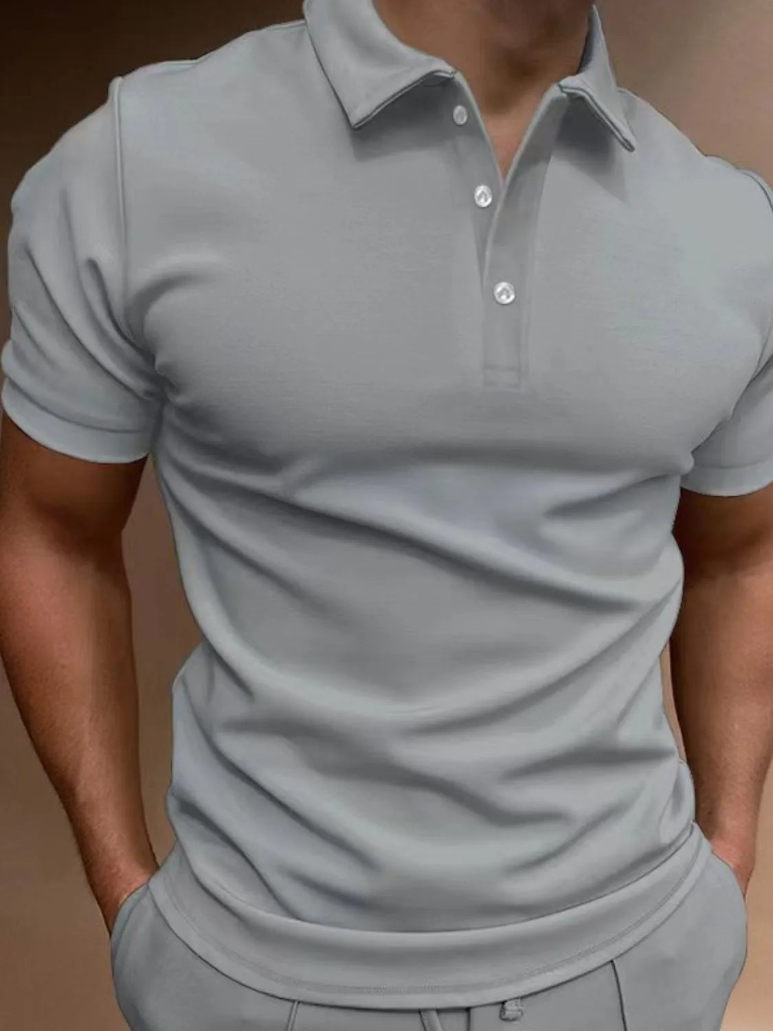 Gray polo shirt with short sleeves and a two-button placket, athletic fit