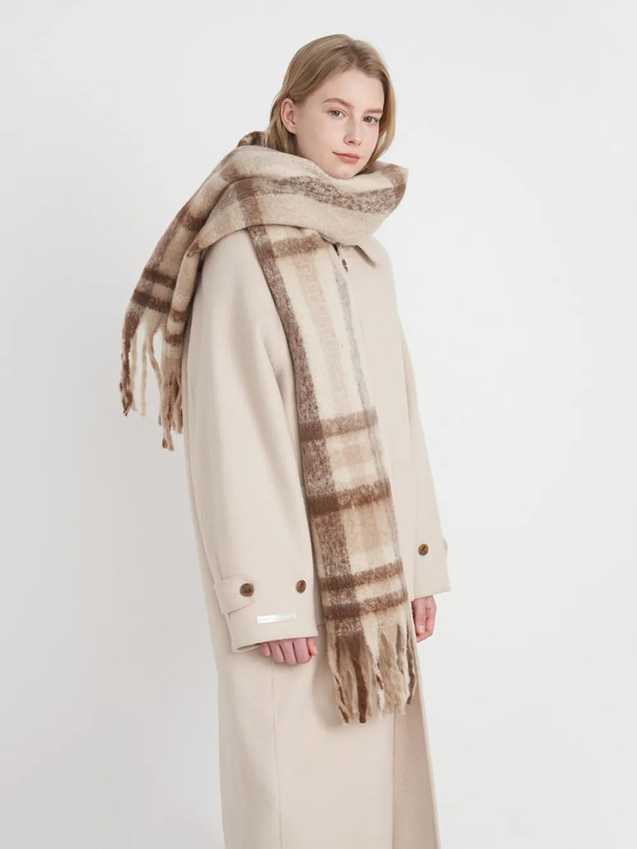 Textured plaid fringe wrap scarf in brown/white plaid with fringed ends.