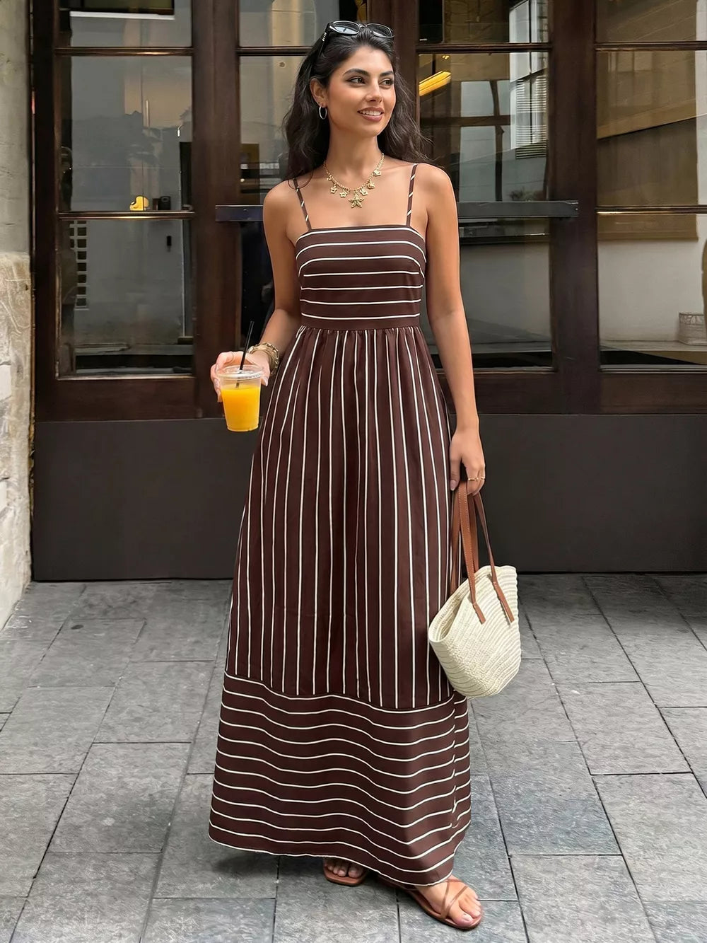 Brown striped maxi dress with smocked detail and cutout, spaghetti straps