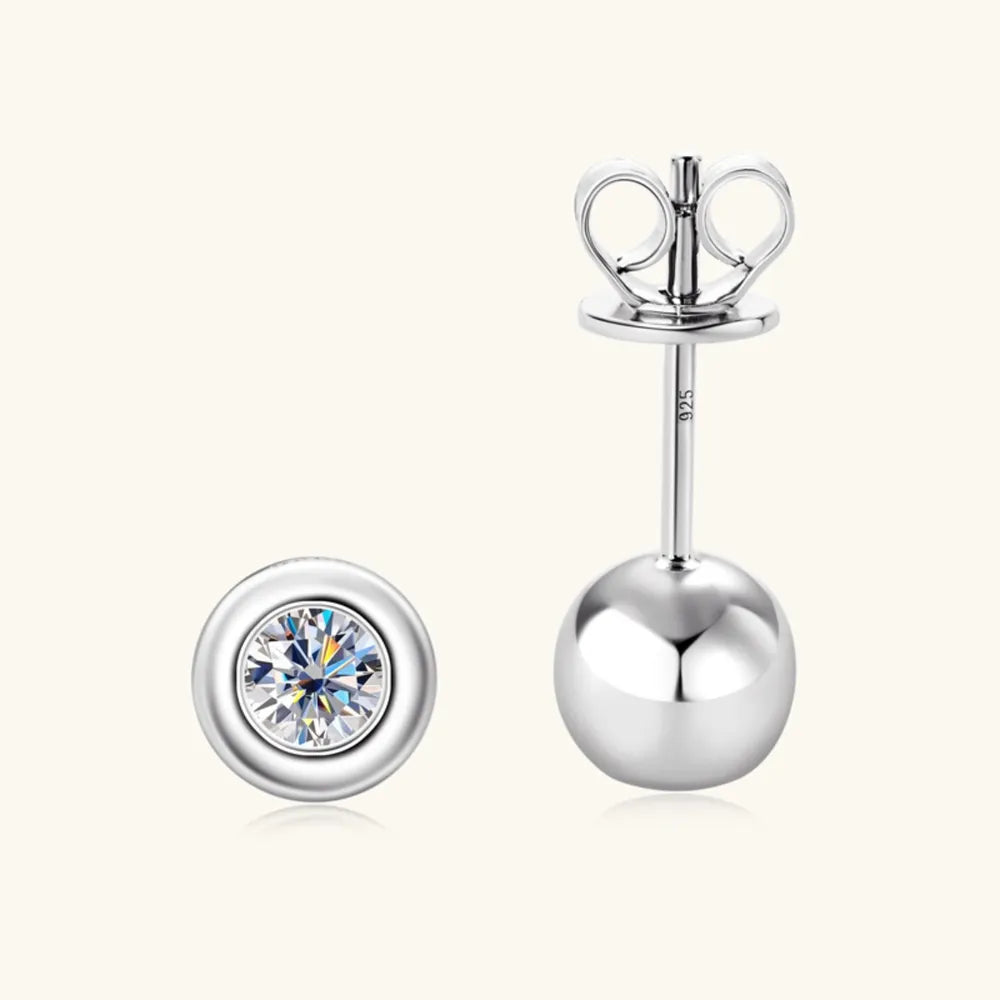Silver bezel-set crystal stud earrings with a ball back.