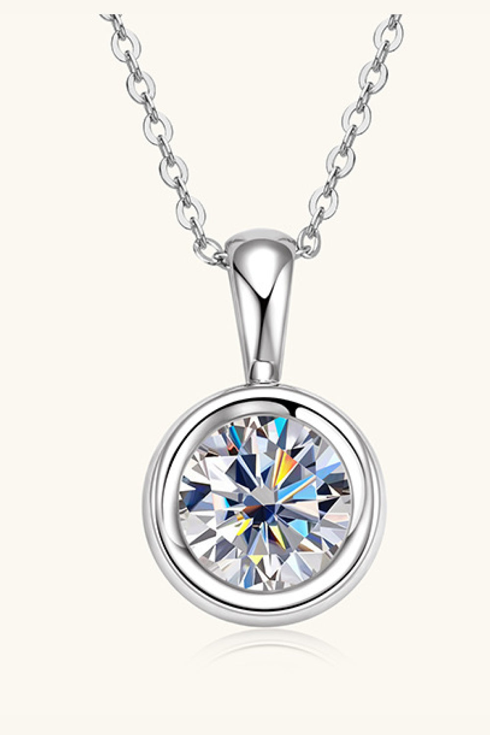 Silver solitaire bezel pendant necklace with a round-cut cubic zirconia on a delicate chain.