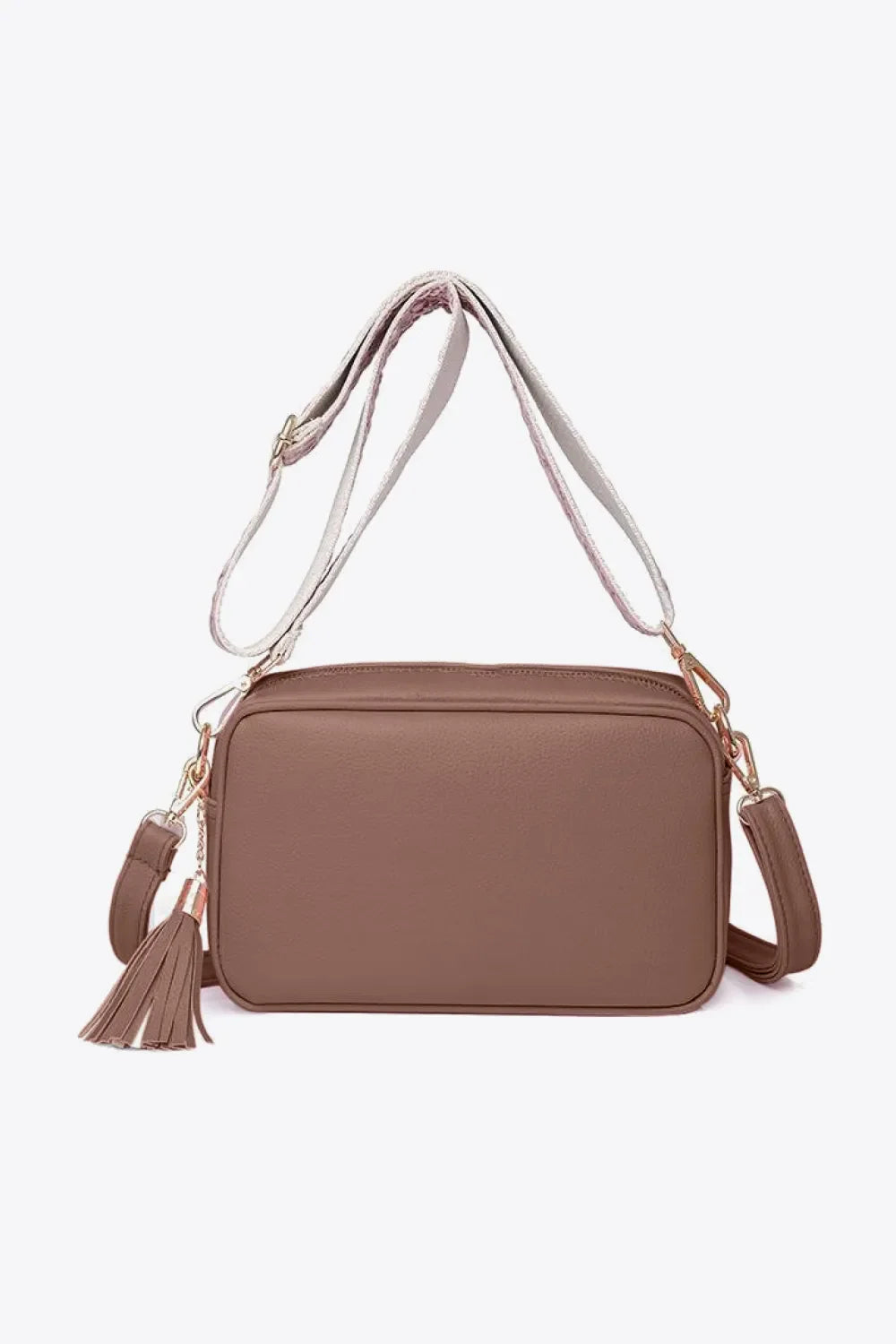 Textured crossbody bag in brown with tassel detail and adjustable strap
