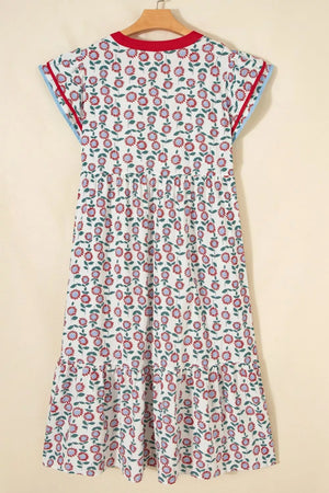 Vibrant floral midi dress with tiered hem, short sleeves, and contrast trim.