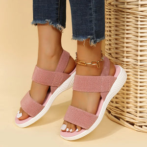 Dusty Pink knit strap sandals with white soles and a gold ankle chain.