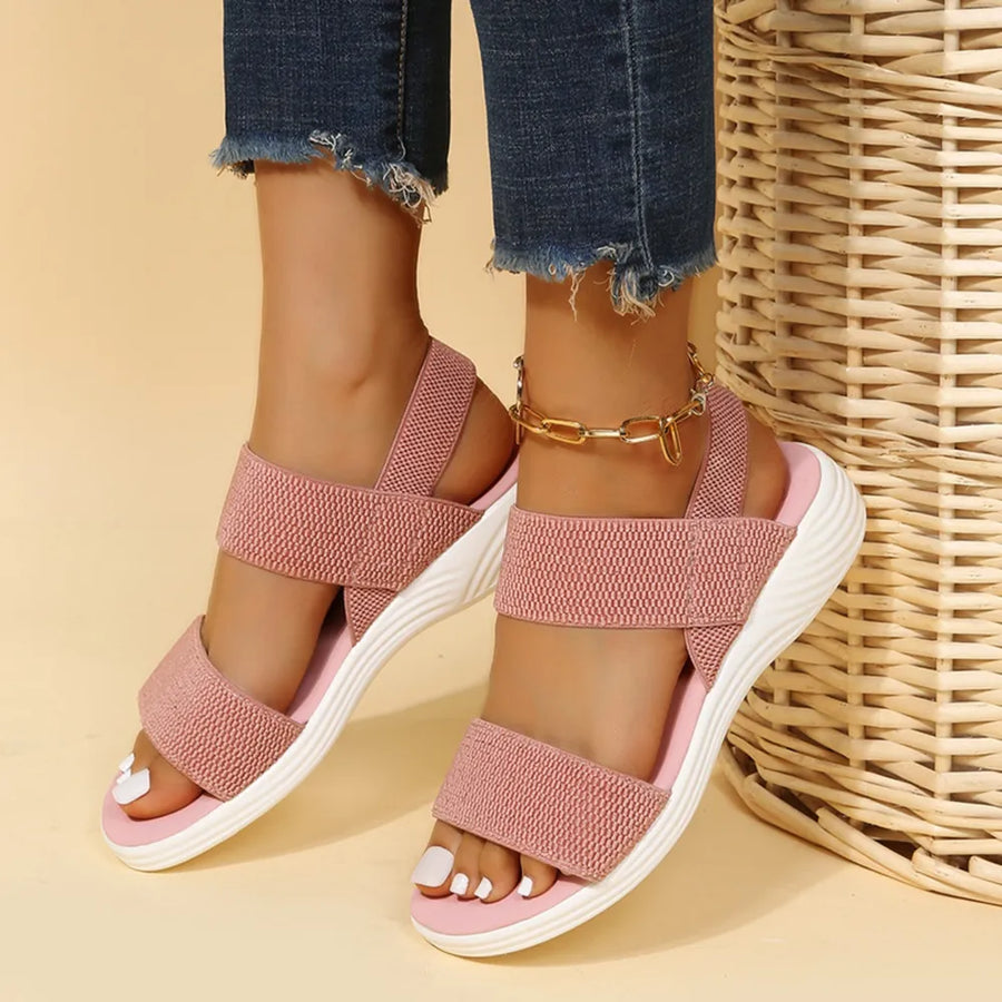 Dusty Pink knit strap sandals with white soles and a gold ankle chain.