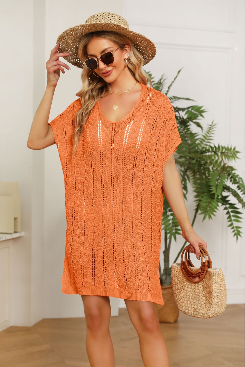 Orange open-knit beach cover-up dress with short sleeves and a v-neck.