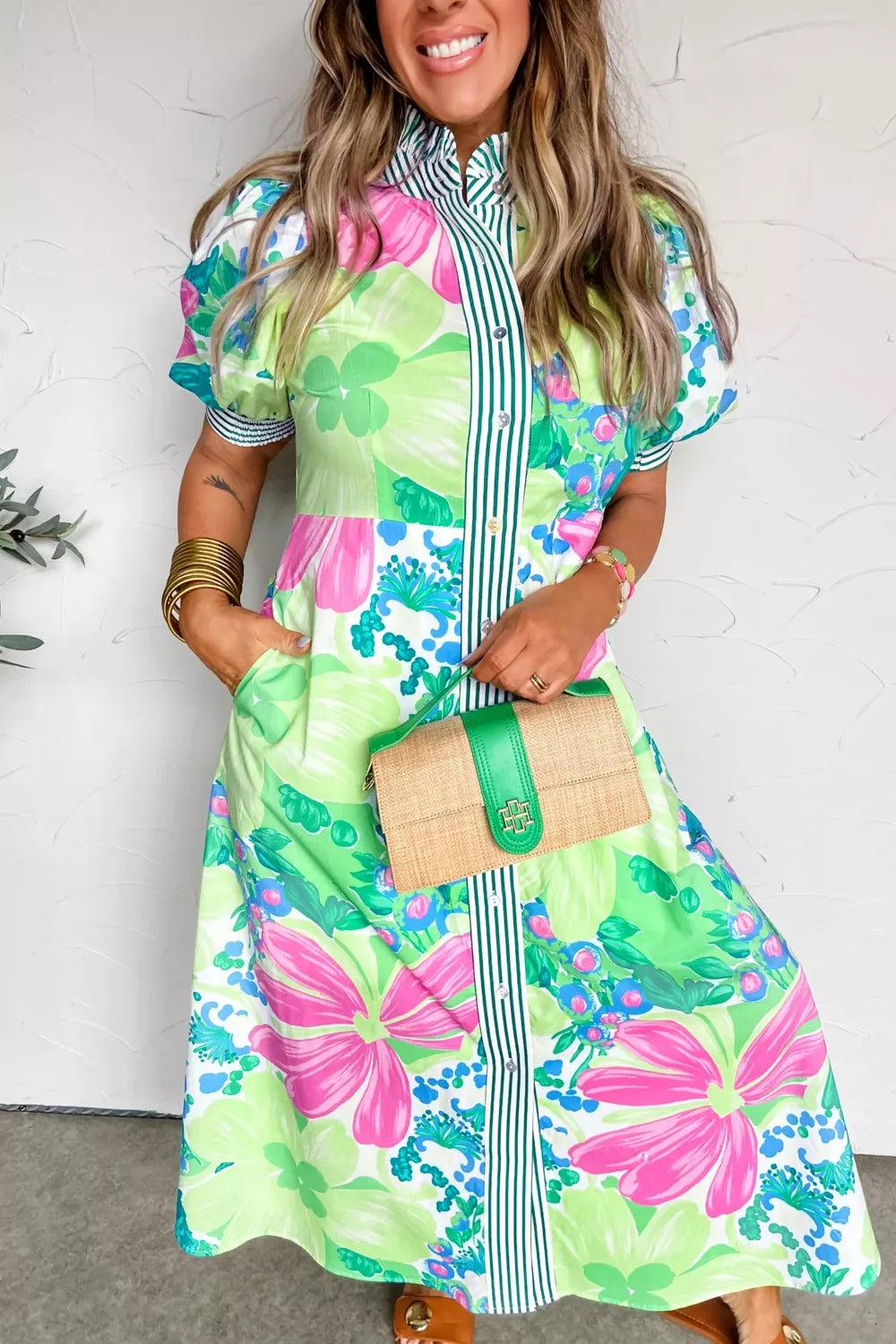 Charming floral midi dress with puff sleeves, collared neckline, and button front.