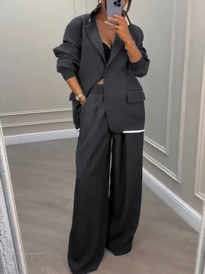 pantsuit in charcoal featuring contrast stitching and relaxed fit