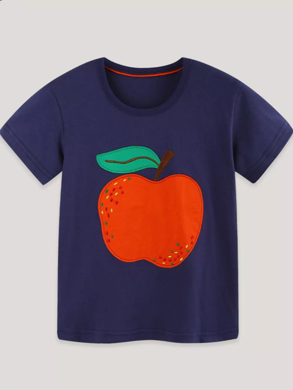 Navy cotton t-shirt with cheerful orange apple appliqué and green leaf detail.