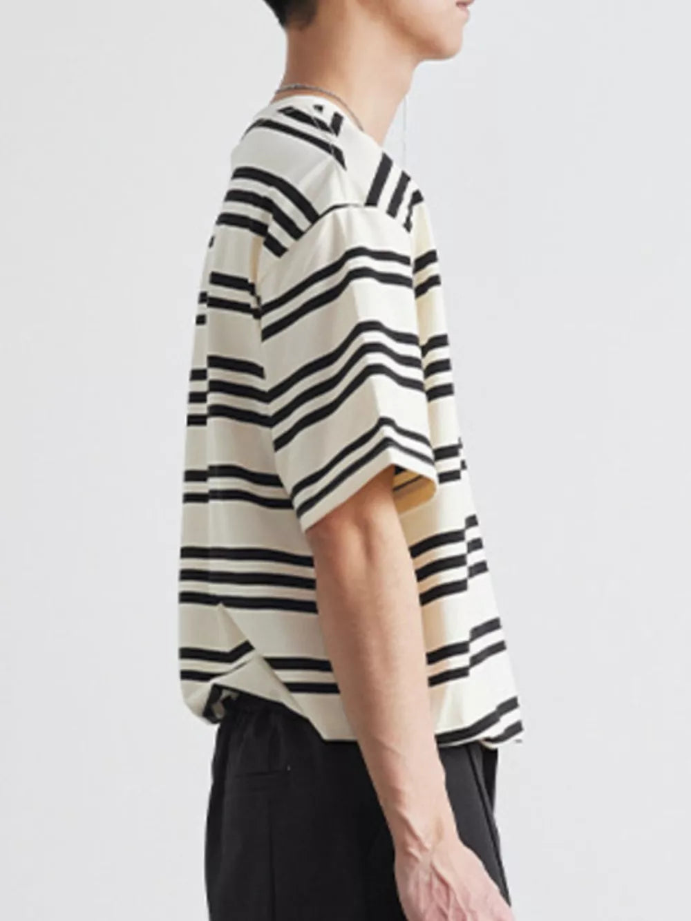 Men's striped cotton crew neck tee in apricot with black stripes.