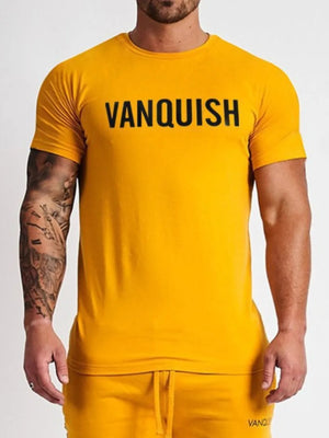 Mustard crew neck t-shirt with bold black VANQUISH graphic.