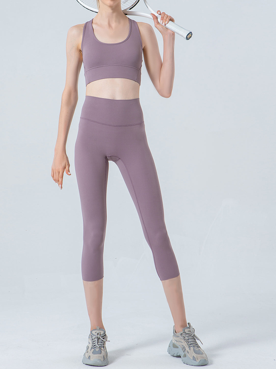 Lavender cropped leggings with a high waistband and subtle mesh detail at the ankle.